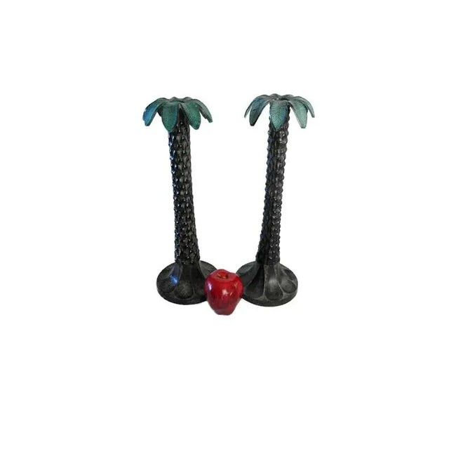 Large metal palm tree candlesticks. Set of 2. Each is 5.75" base diameter, 15.75" high. Heavy. The holders will hold...