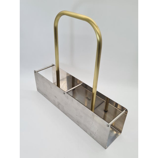 An original German bottle rack for four bottles, made of stainless steel. The item bears the original RISTOK label—Metall-...