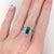 This beautiful ring features a 4.77 carat emerald cut Blue Zircon gemstone with a halo of natural earth mined diamonds and...