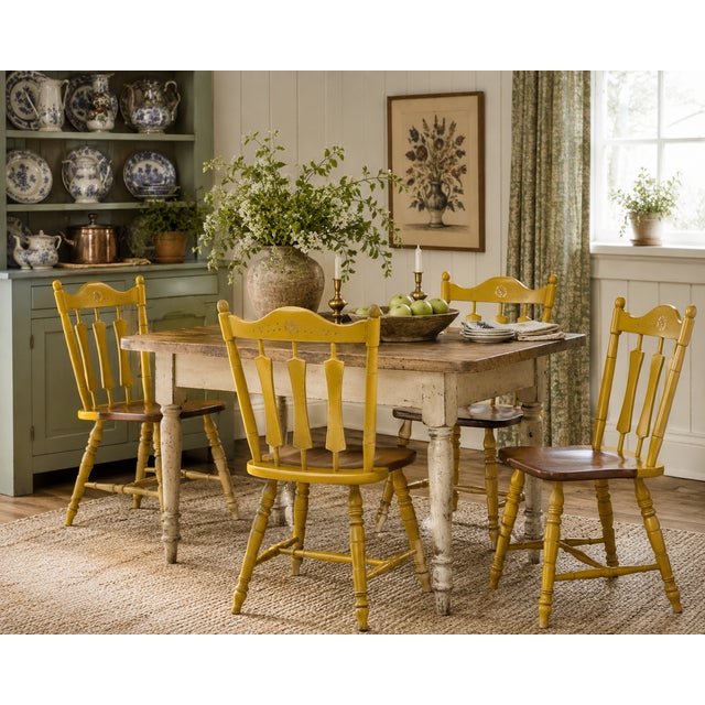 A charming set of four vintage Temple-Stuart dining or side chairs in a warm mustard yellow painted finish with...