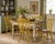 A charming set of four vintage Temple-Stuart dining or side chairs in a warm mustard yellow painted finish with...