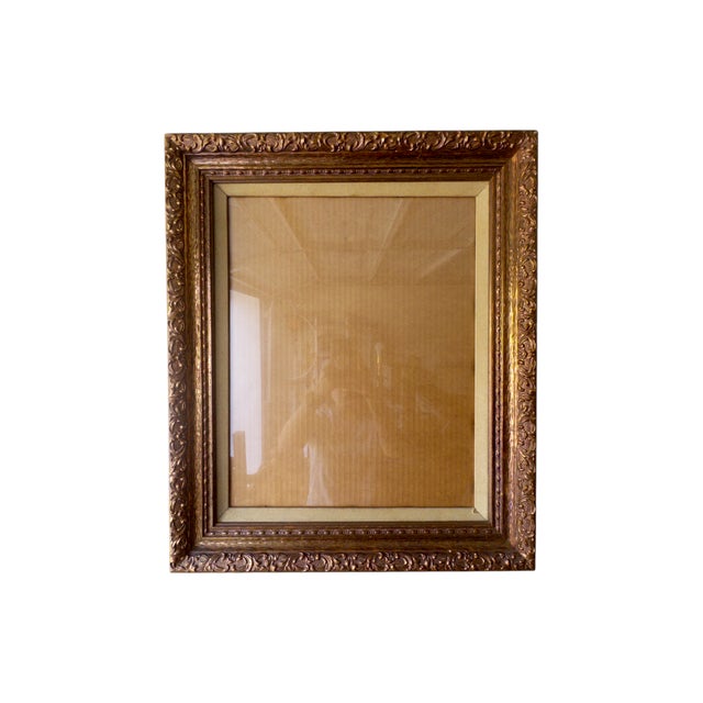 This vintage ornate frame (c. 1960s–1970s) features richly detailed gesso ornamentation over wood, with its glass front...