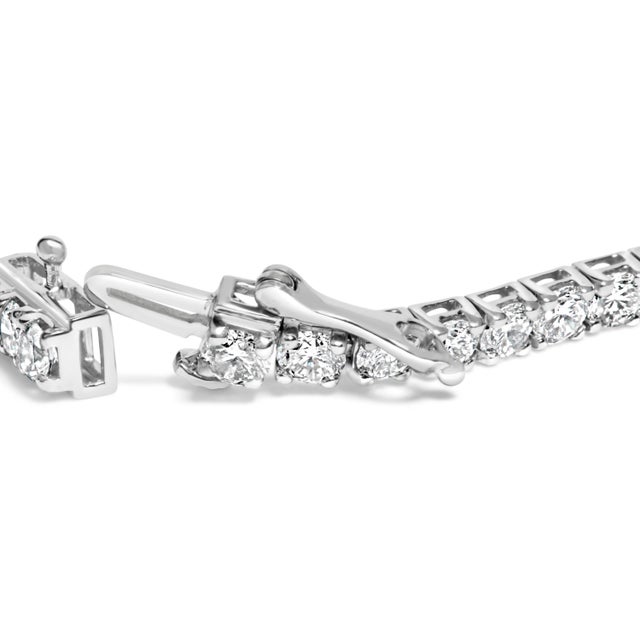 Immerse yourself in the timeless elegance of this 14K white gold tennis bracelet, where sophistication meets modern...