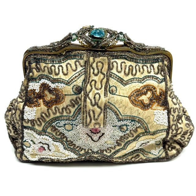 A very old but lovely beaded purse from France. The condition is more for art than actually using this purse. It has...