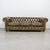 A striking vintage English Chesterfield sofa in rich olive green leather, crafted in the Victorian style during the...