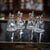 Antique 20th century english solid silver and cut glass set of four whisky decanters, each of conical form with a solid...