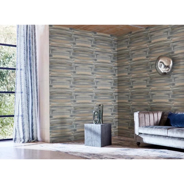 Mirrored brush strokes with twists of colour give the illusion of fabric on the wall in this painterly Anthology wallpaper...