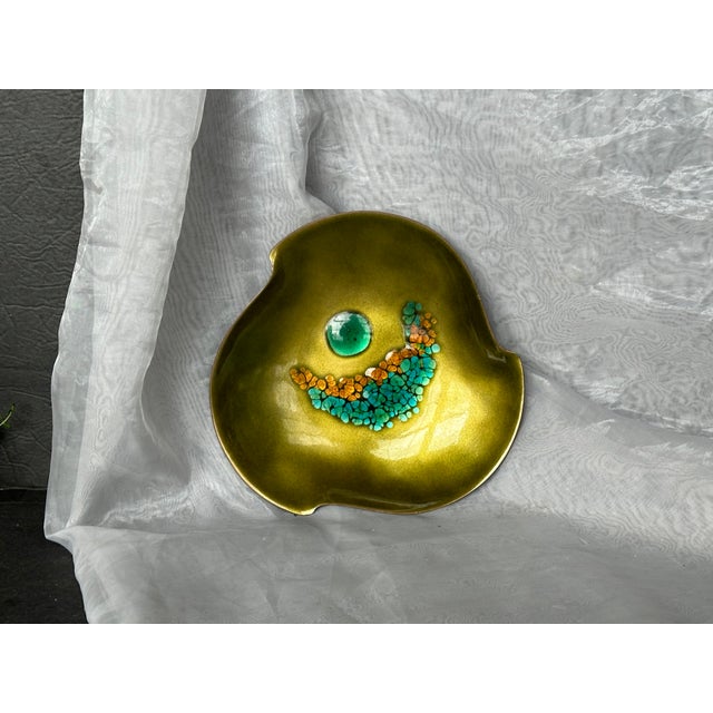 This vintage bowl is a wonderful example of mid-century modern copper enamel work. The colorful aqua blue & orange...