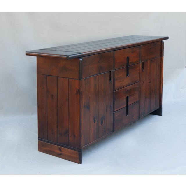 A striking Brutalist sideboard designed by Silvio Coppola for Fratelli Montina, Italy, circa 1970s. Crafted in solid pine...