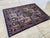 This vintage rug is hand-knotted in wool, woven in the Serab Persian design tradition. Measuring 5'1" x 7'2" (156 x 218...