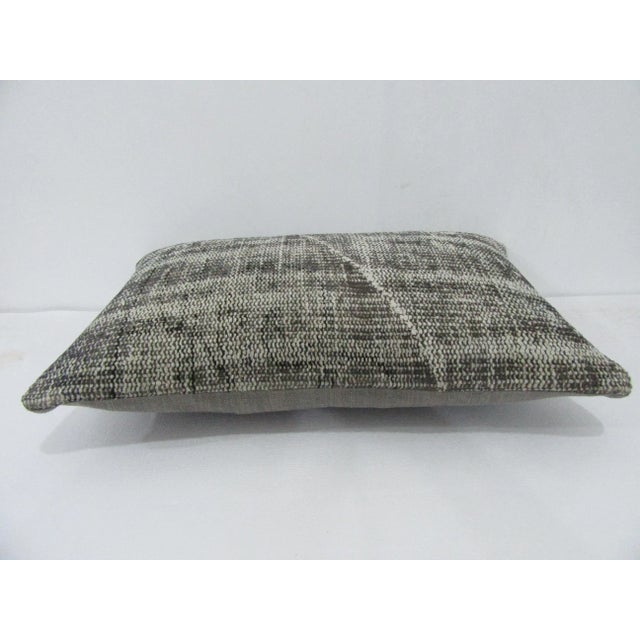 Decorative pillow cover made from a vintage Turkish handknotted rug. Backed with good quality cotton fabric. Pillow...