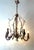 Italian Gilt Iron Five-Light Chandelier with Porcelain Flowers, circa 1930 This enchanting five-light chandelier was most...