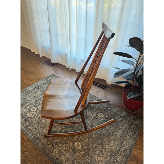 Striking mid-century modern rocking chair attributed to Arthur Umanoff for Washington Woodcraft, circa 1960s. The chair...