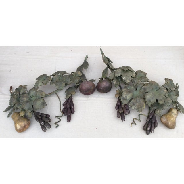 Great thick heavy wrought iron fruit and leaf fragments that can be used indoors or outside.