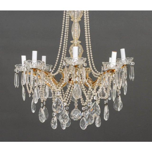 Italian Crystal Chandelier, with eight-branch brass frame &nbsp;waterfall crystal bead form and faceted tear drops. 42" H...