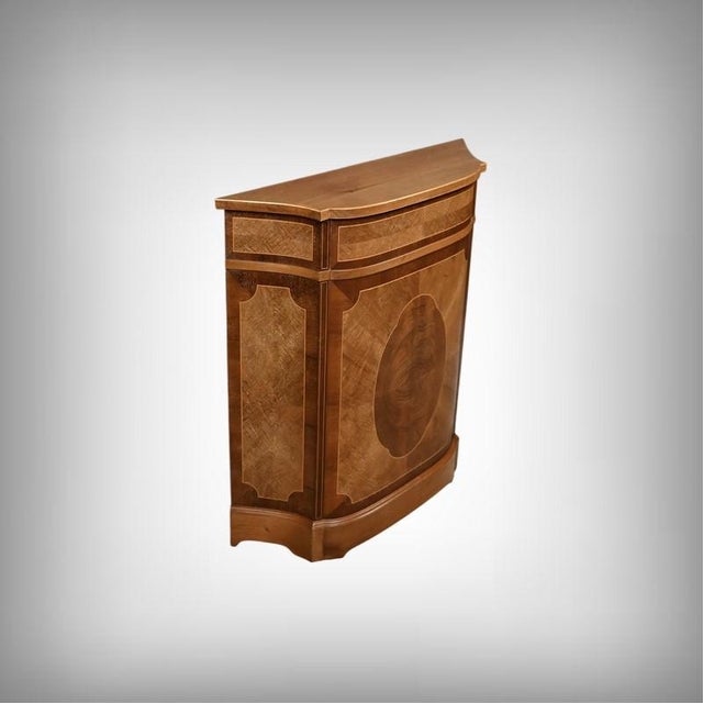 This elegant mahogany console table is distinguished by its solid structure and flowing form. Its slightly curved front...