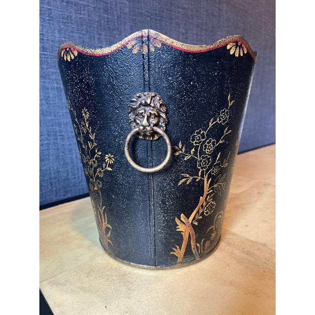 An Italian tole metal wastebasket or cache pot in the Chinoiserie style. The main colors are black and gold with touches...