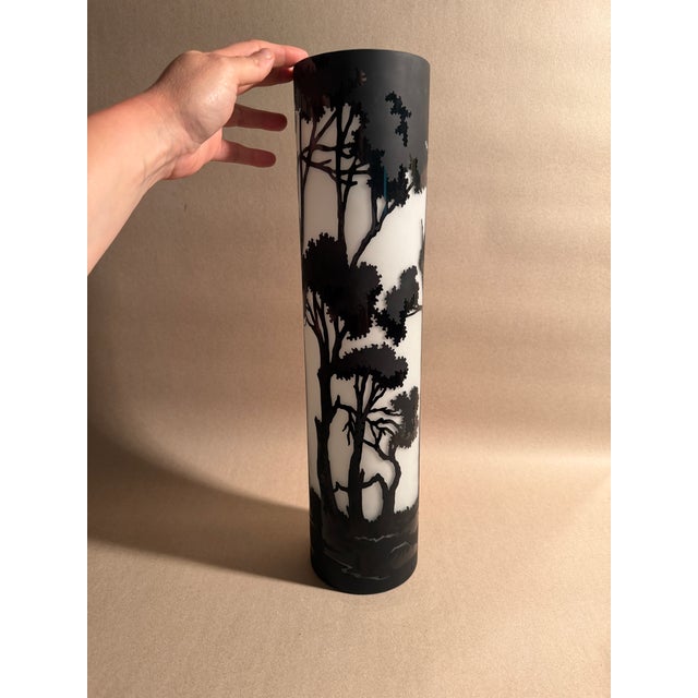 A very large cased glass cylinder with carved away black exterior, in matte and gloss black. Art nouveau in style, hand...