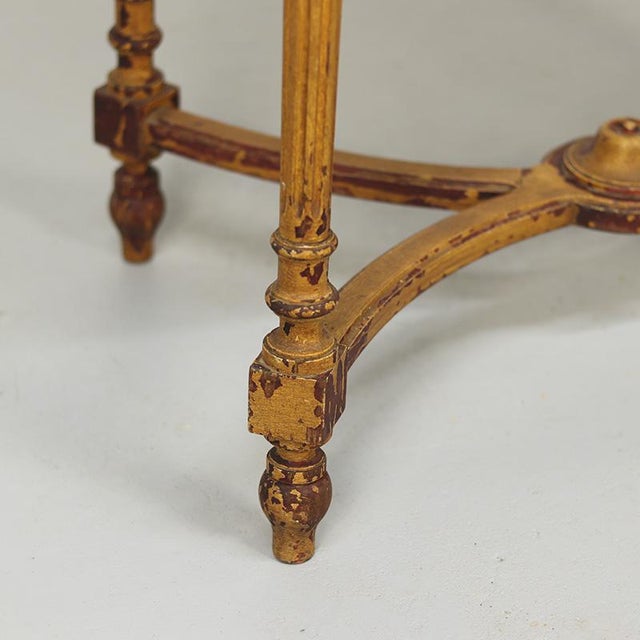 This charming French side table from the early 20th century is finished with a beautiful, weathered faux-bois paint layer....