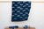 A masterwork of Malian textile heritage featuring deep indigo saturation and symbolic geometric motifs. Originating from...