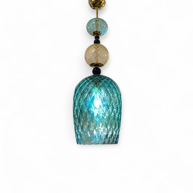 A stunning ceiling lamp crafted from Murano glass, a premium and highly exclusive material made by Venetian glassblowing...