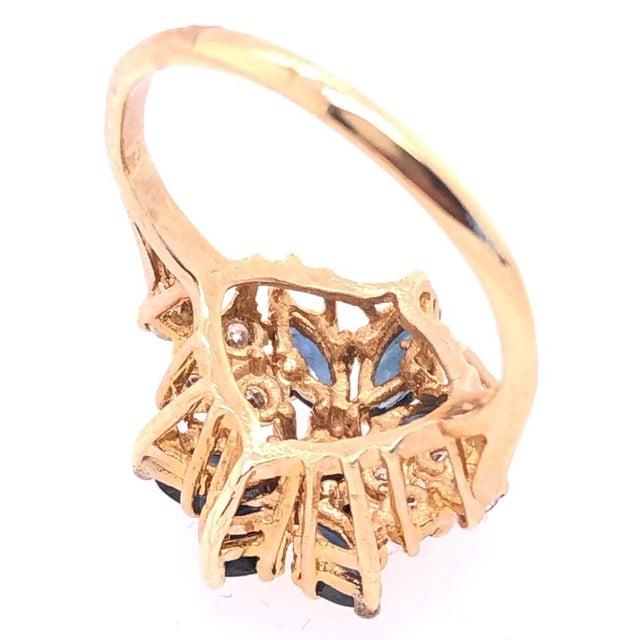 14 Karat Yellow Gold Cluster Ring with Onyx and Diamonds Size 6. 8 round diamonds 3.60 grams total weight.