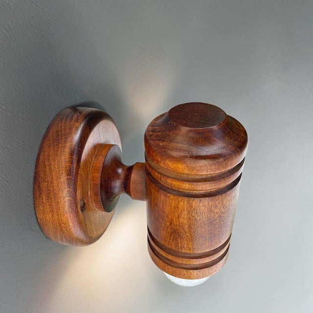 Vintage turned pine wooden wall sconce, likely to be made in denmark in the 1960s. a distinctive vintage wall light...