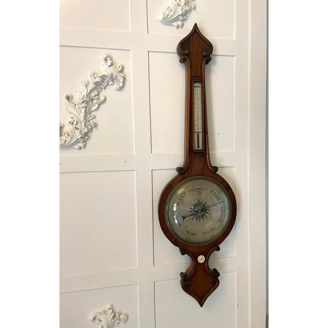 Large antique Victorian quality rosewood banjo barometer having a quality rosewood banjo shaped case with carved scroll...
