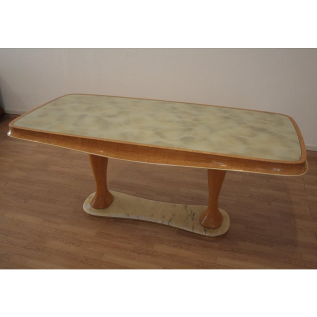 This Mid-Century Modern dining table by Vittorio Dassi from the 1950s is an original piece with a unique design in mid-...
