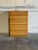 This vintage tallboy chest of drawers features a clean-lined geometric silhouette and integrated recessed finger pulls for...