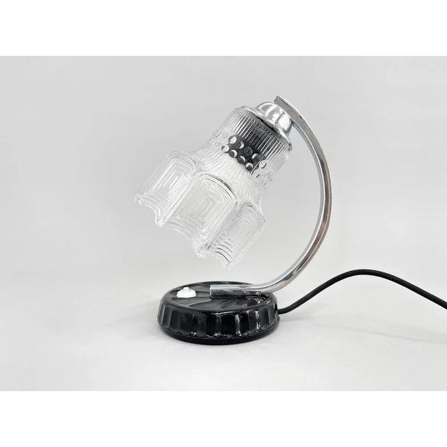 Mid-century table lamp made of chrome, metal, clear glass and black ceramic base. New wiring. Up to 250V (Europe/UK...