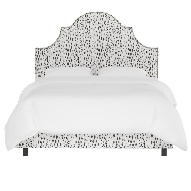 Classic curves wrapped in smooth upholstery, then accented with elegant ornamental nailheads, gives this Upholstered Bed...