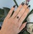 A natural red spinel glows with vivid, fiery red at the centre of this solid 14K yellow gold ring, surrounded by thirty-...