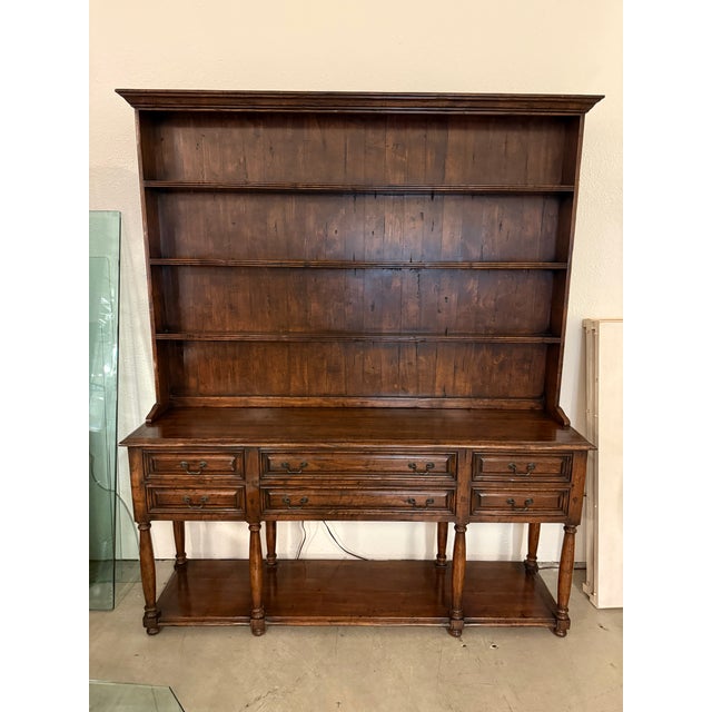 Design Plus Gallery presents a Two Piece Wooden Hutch with Drawers in a Welsh Design Style. Its upper section has a...