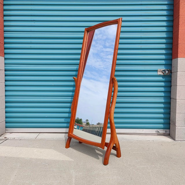 Just in, an extraordinary studio made mirror. Sourced from the original owner, this sleek mirror features curvaceous frame...