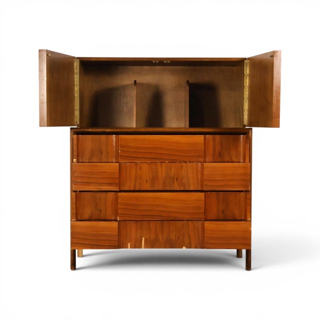 This 1960s Edmond Spence highboy dresser is a striking example of Swedish mid century modern design, built in warm walnut...