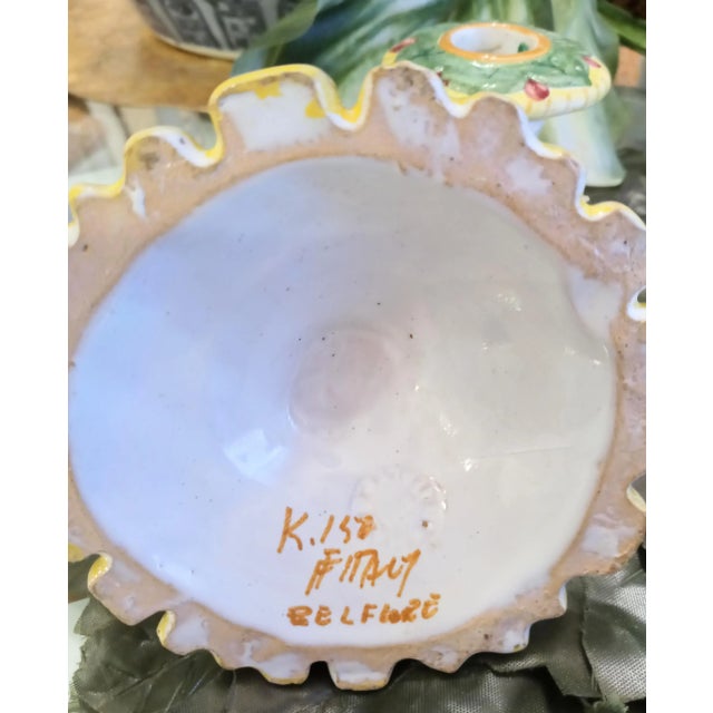 A beautiful set of 4 Italian ceramic hand painted floral short candle stick holders. The set has such pretty hand painted...