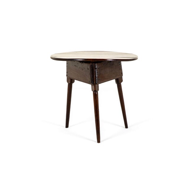 A wonderful 18th century oak cricket table with a rustic weathered three plank circular top. The table is raised on square...