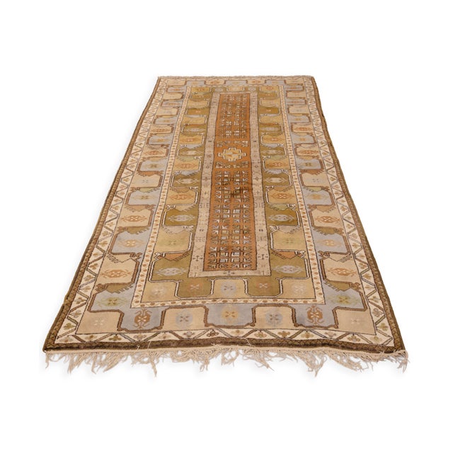 A finely crafted Old Milas rug from Turkey, woven from 100% pure wool. This piece showcases the traditional geometric...