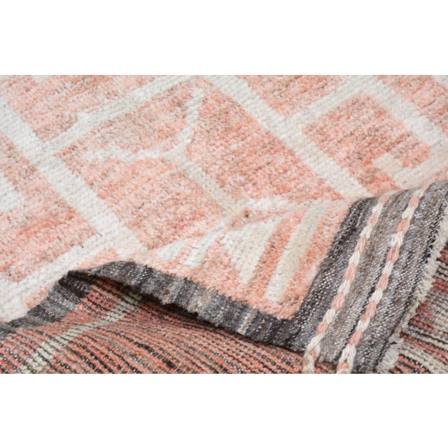 Hand-knotted with care using traditional rug-making techniques, this wool rug blends timeless craftsmanship with a modern...