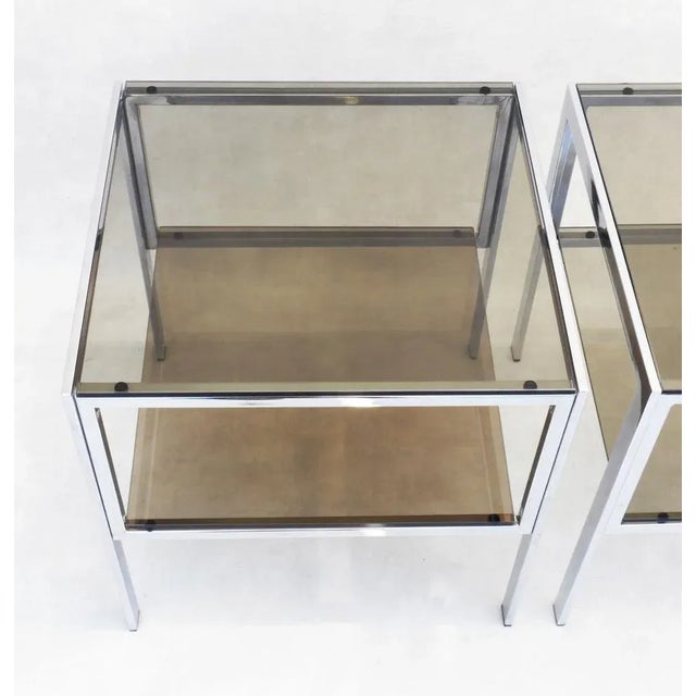 Vintage French Chrome and smoked glass side tables c1970. A pair of stylish two tiered tables that can be placed as...