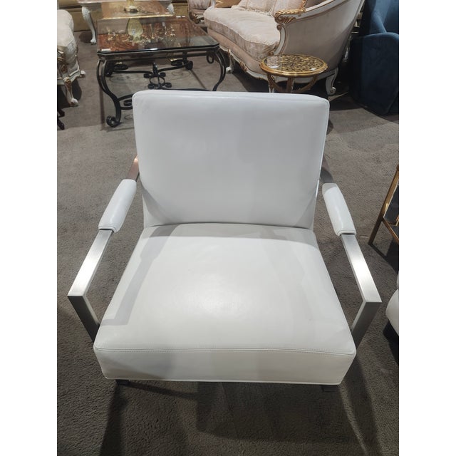 This Chunky Milo lounge chair is a Milo Baughman classic with its dramatic, geometric metal frame and sumptuous seating...