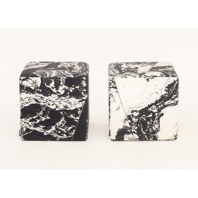Pair of Unison Black Marble Upholstered Cube Ottomans, with "Unison" label. 17" H x 17" W x 17" D. Provenance: From a New...