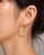 Elegant 14K yellow gold diamond hoop earrings featuring numerous brilliant round diamonds totaling 1.7 carats. Estate pair...