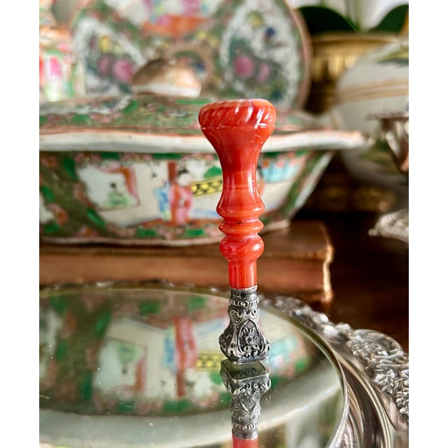 A charming French desk seal featuring a finely turned hardstone handle, likely carnelian or banded agate, mounted in an...