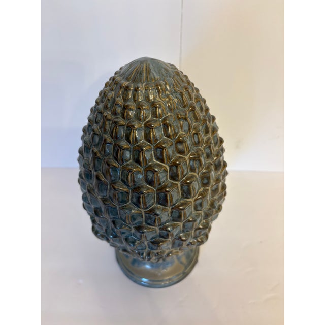 This rustic pine cone with the colors of grey, blueish and rustic colors is perfect for a desk, entryway table, side table...