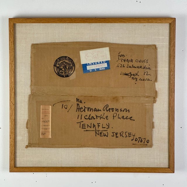 A salvaged corrugated shipping box portion that includes all the shipping info from a parcel shipped by the artist Chaim...