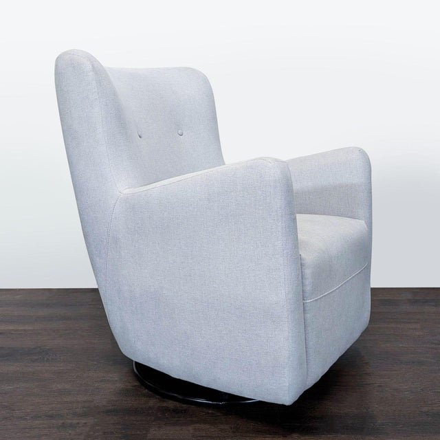 This Pottery Barn Kids lounge chair features a soft grey fabric and a comfortable, supportive design. The chair has a...