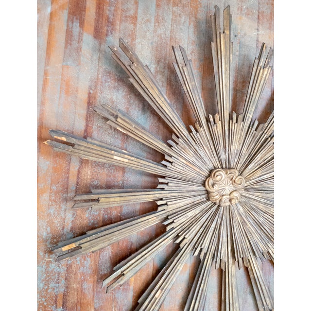 We are selling this large beautiful Baroque style Giltwood Sunburst. This carved wood and gilded sunburst has great scale...