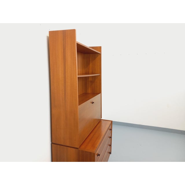 Vintage Scandinavian-style teak bookcase from the 1960s/70s, Italian design, with ample storage: two open shelves, a...